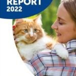 BSAVA PetSavers - Impact report 2022 - Lady holding a ginger and white cat over her shoulder